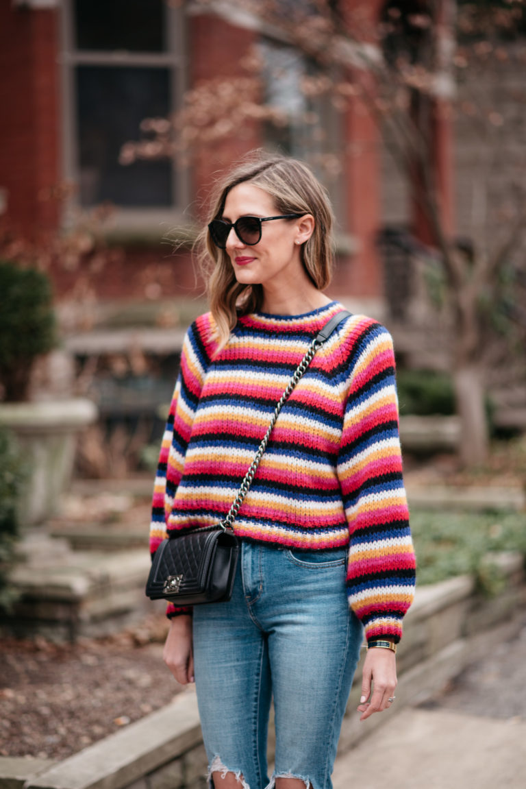 bold colorful striped sweater spring transition end of winter outfit ideas