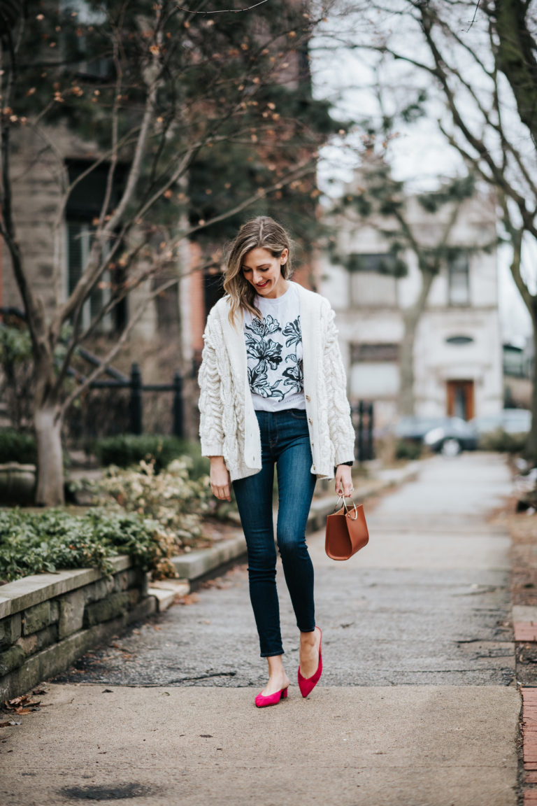 how to wear graphic tees in an outfit with jeans and a sweater