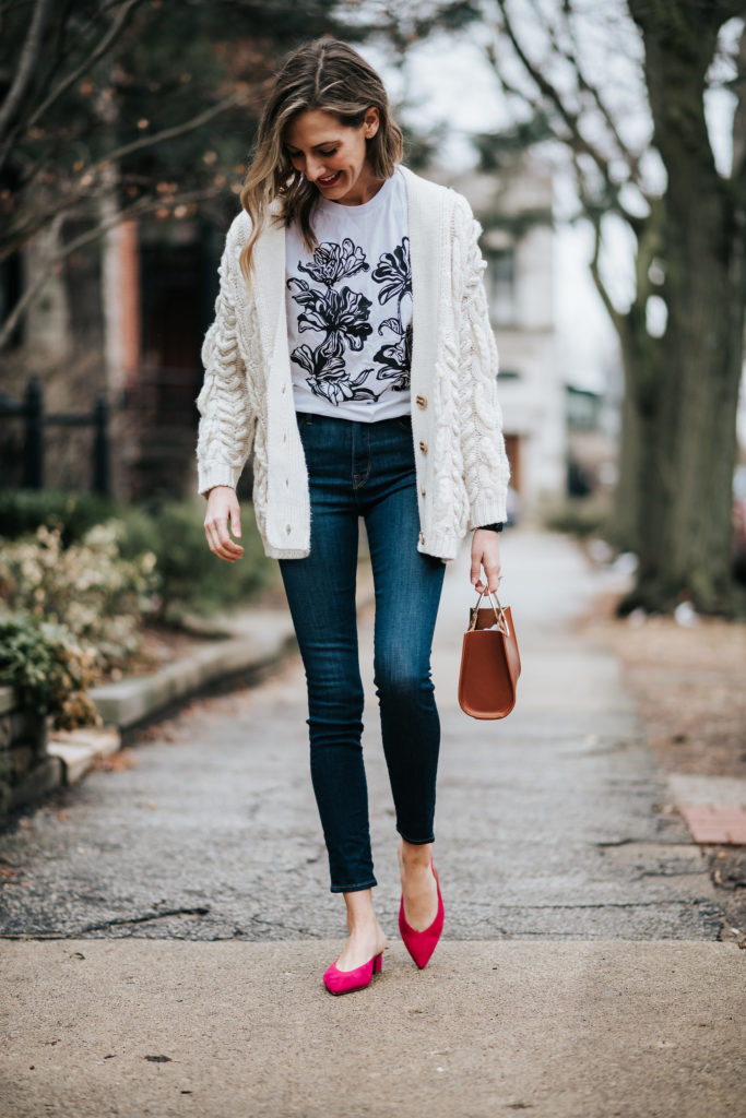 how to wear graphic tees in an outfit with jeans and a sweater