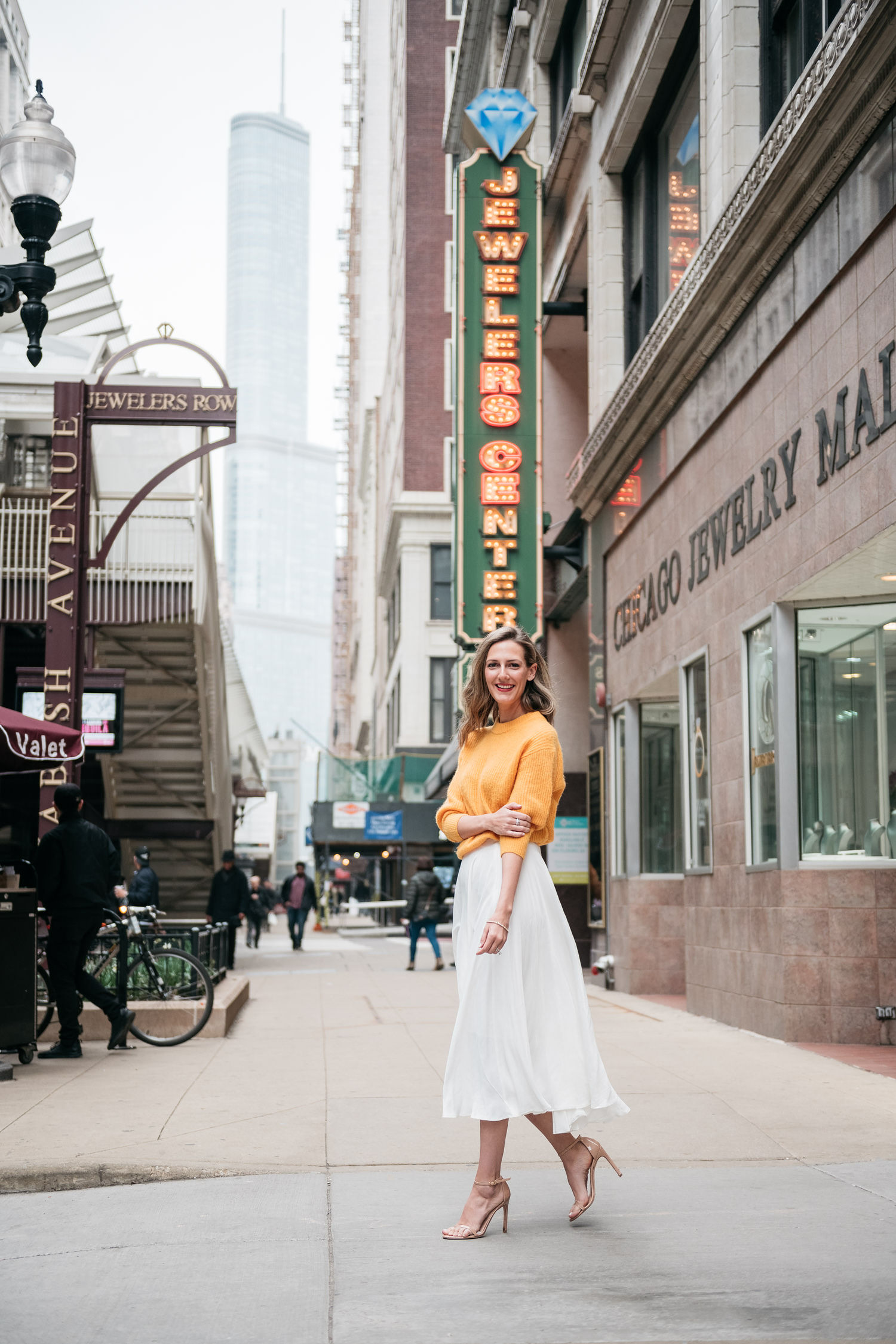 white midi skirt and yellow sweater for spring