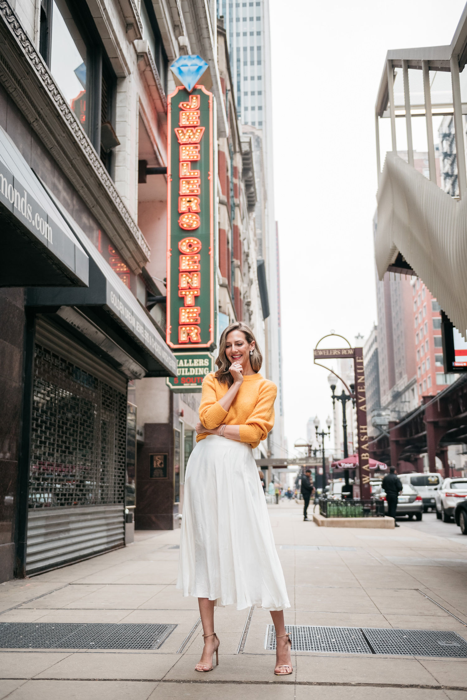 white midi skirt and yellow sweater for spring