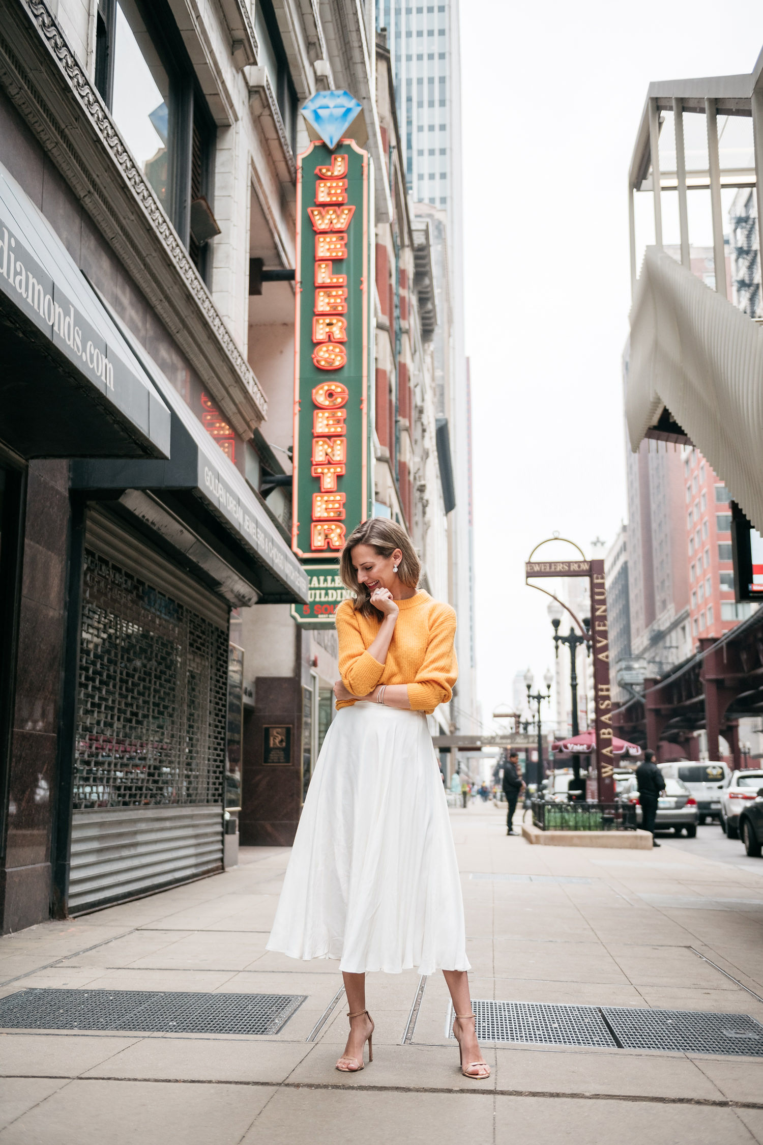 white midi skirt and yellow sweater for spring