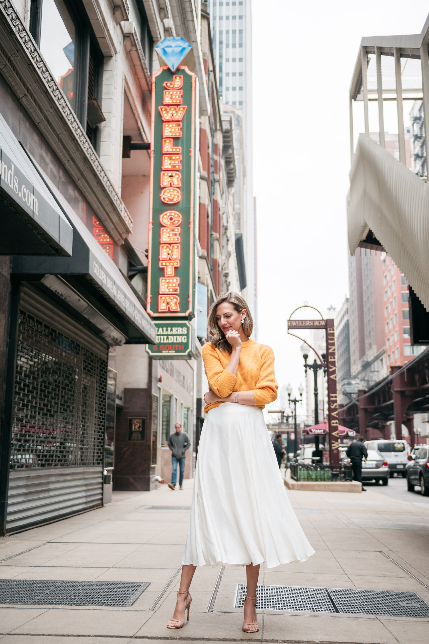 white midi skirt and yellow sweater for spring