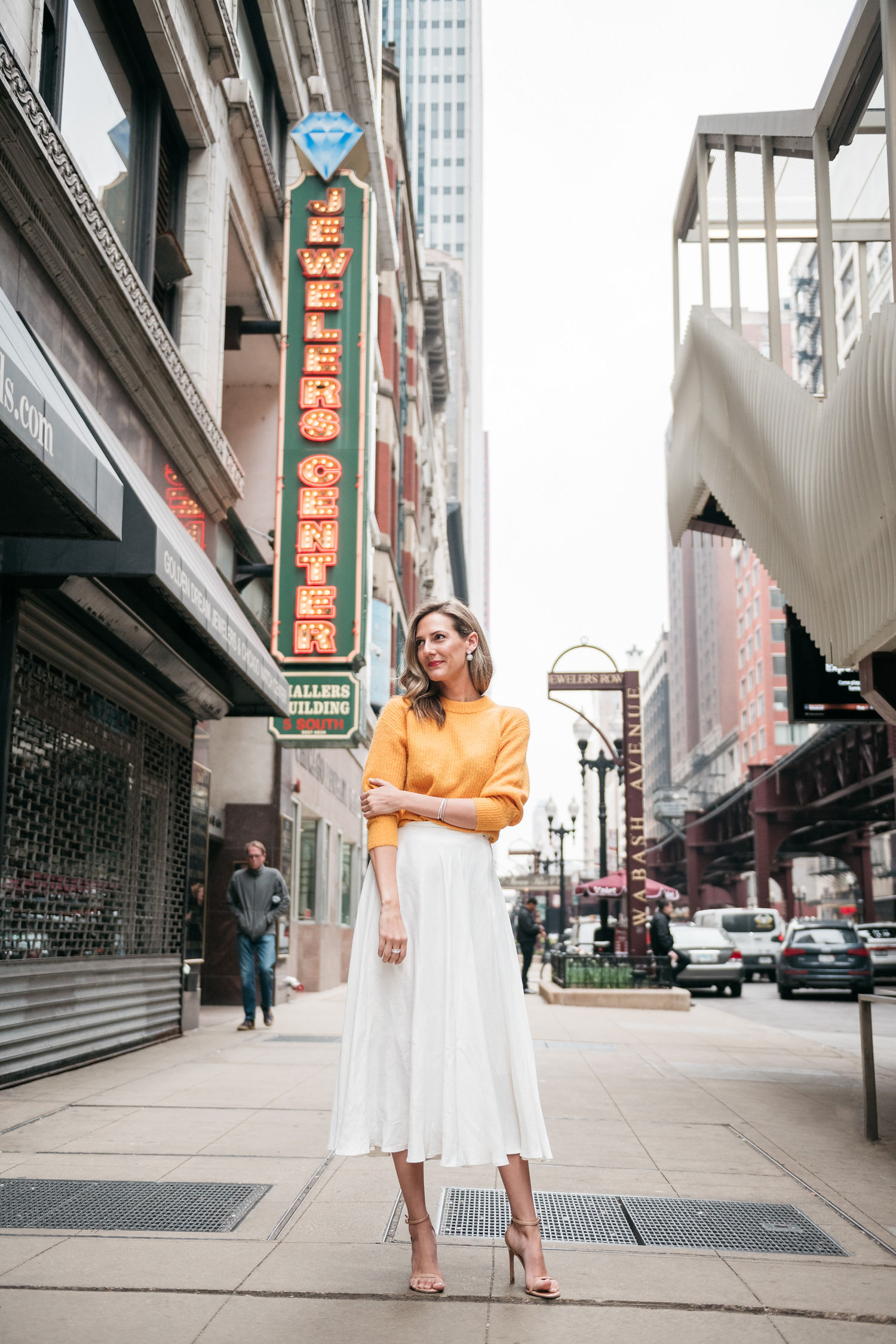 white midi skirt and yellow sweater for spring