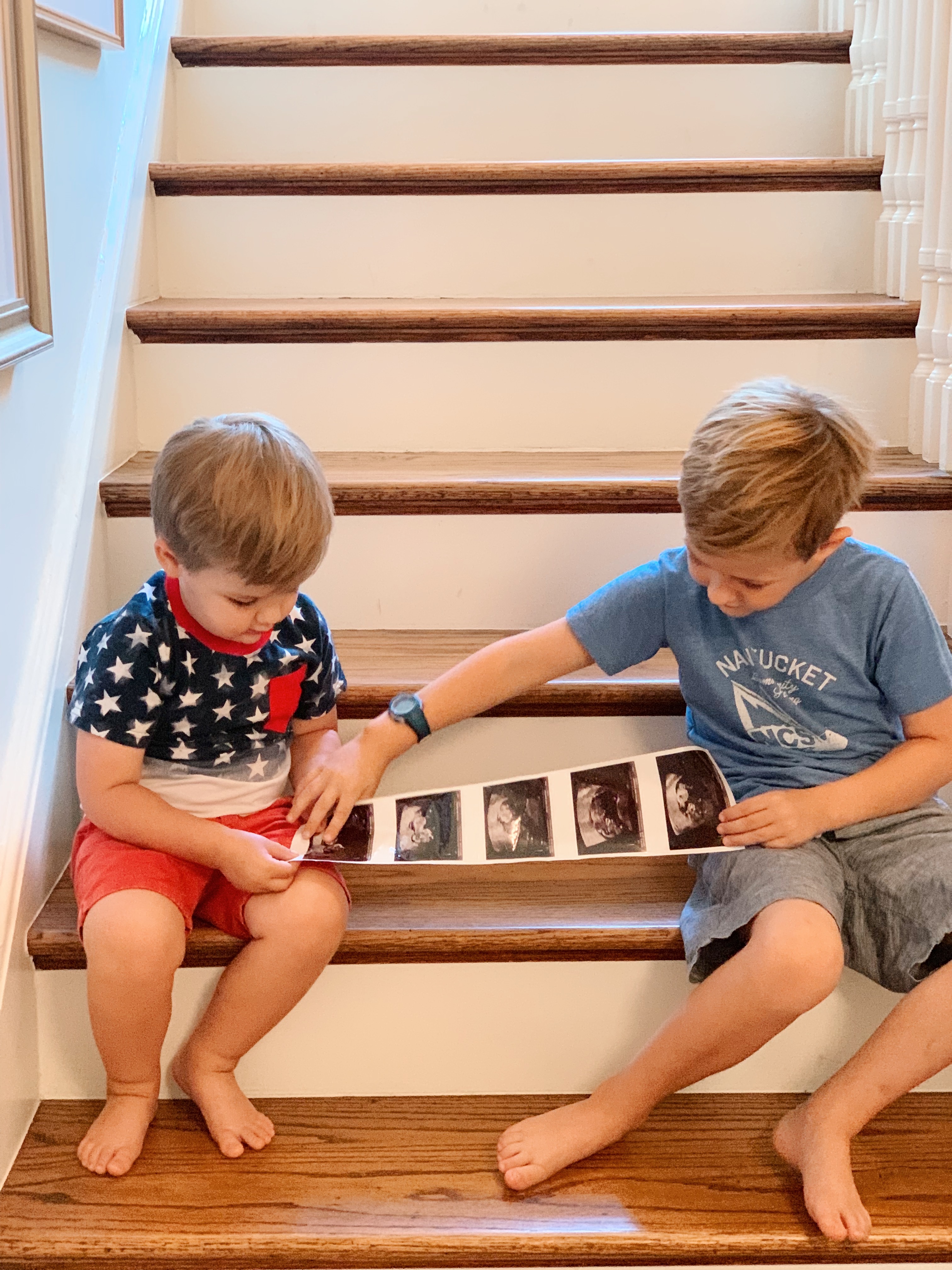 two brothers excited for Baby #3 