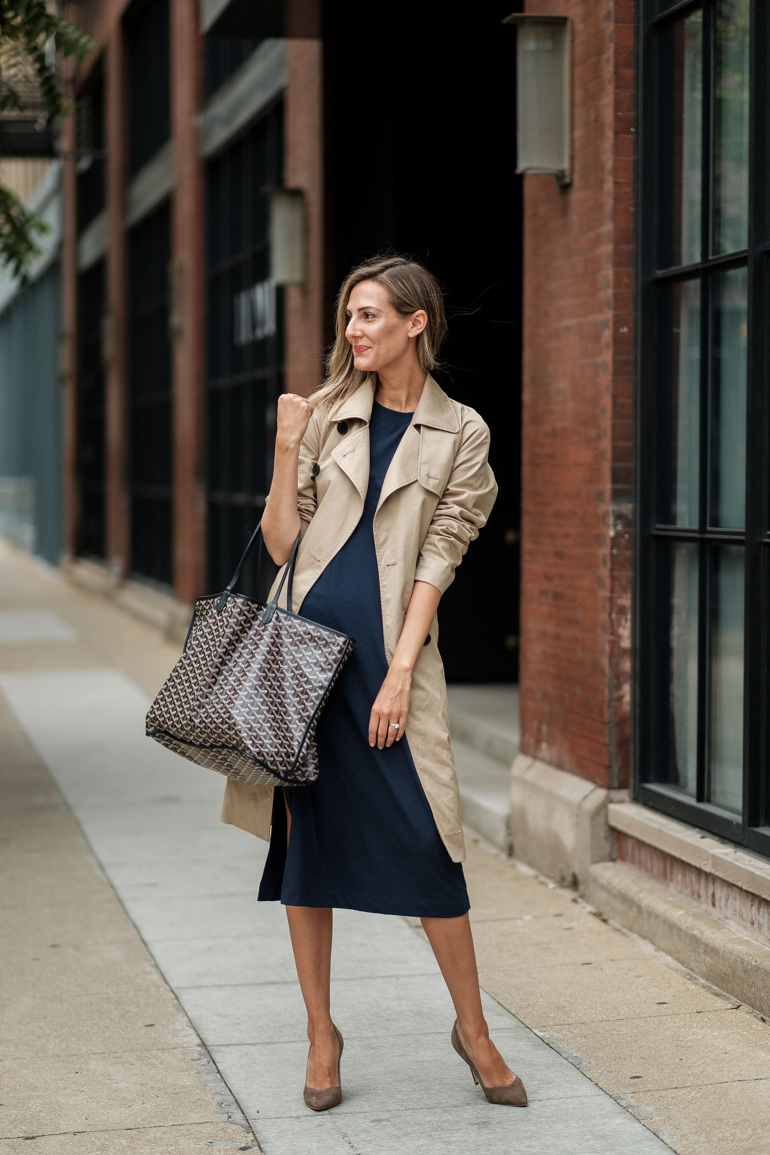 woman in trench coat and dress and answering Style Questions