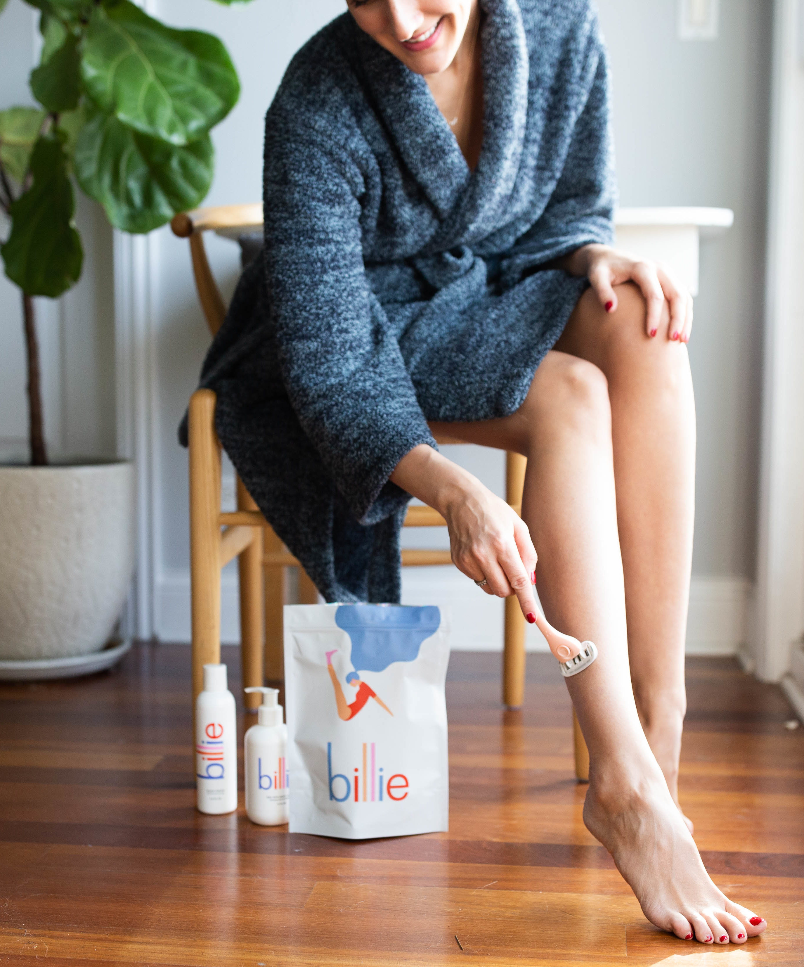 woman using the Billie Razor on her legs