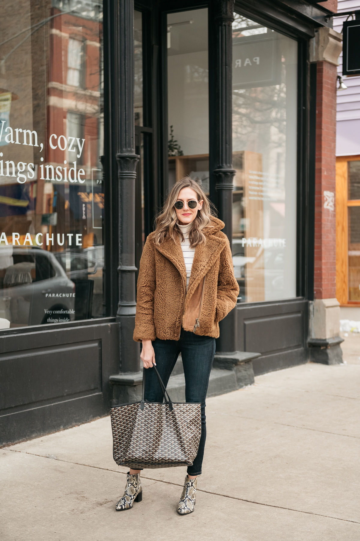 woman in brown jacket, jeans, and bag and sharing In Defense of Hobbies