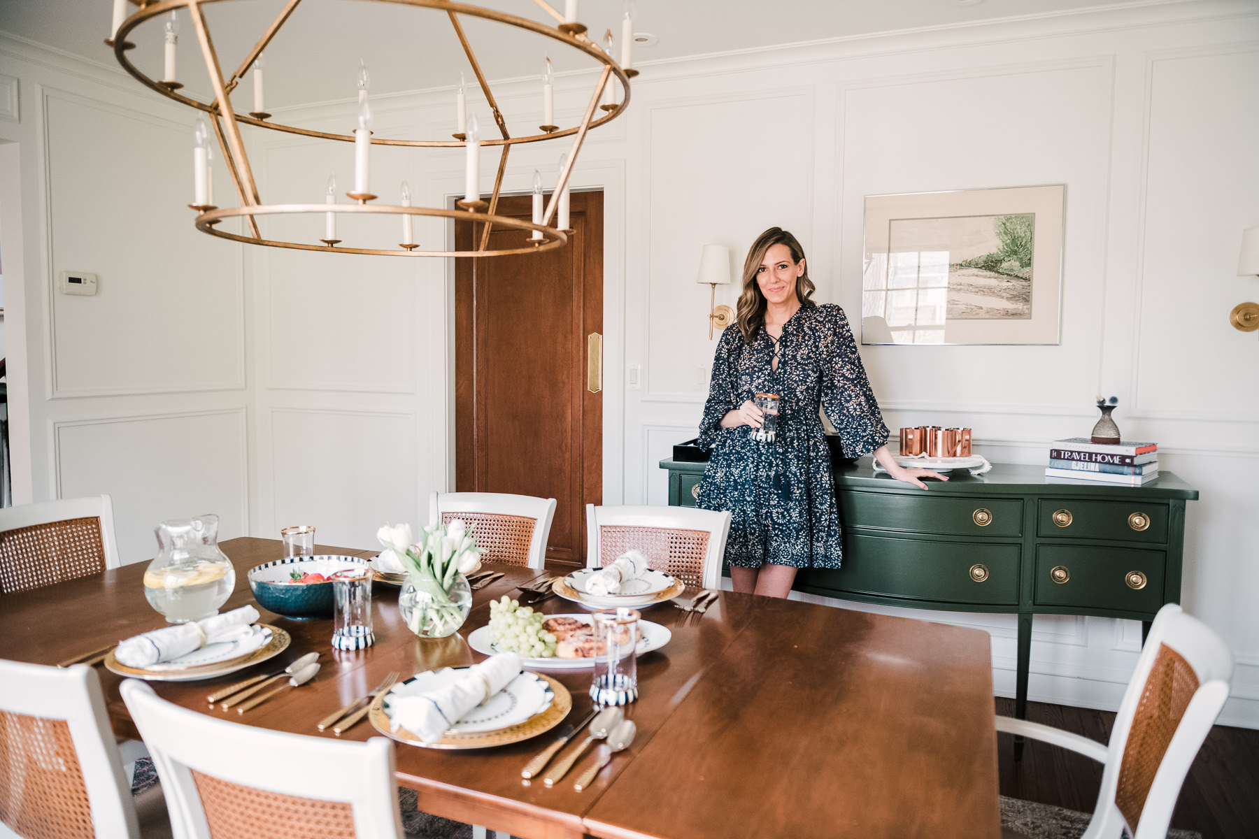 woman leaning on a green drawer in Dining Room