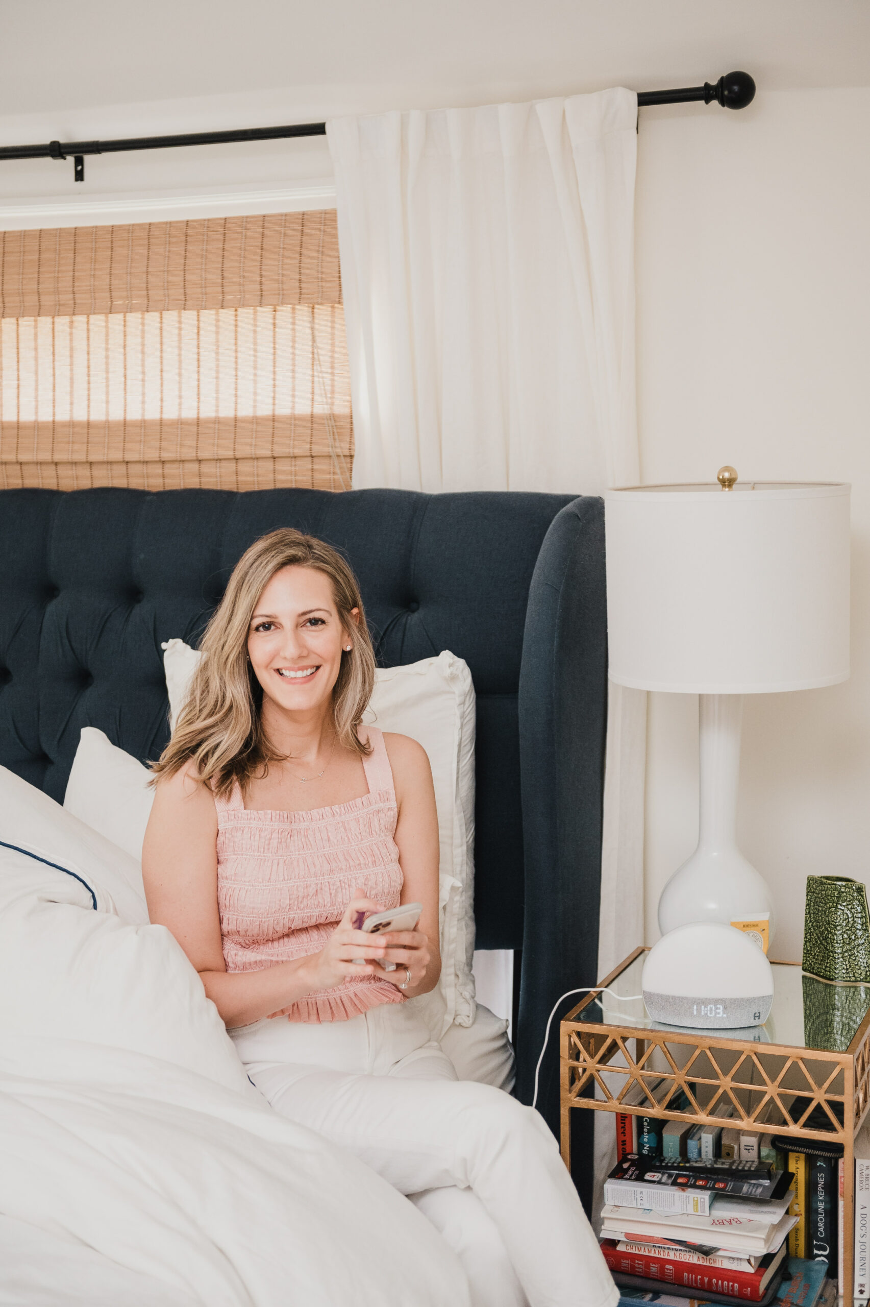 woman sitting on her bed