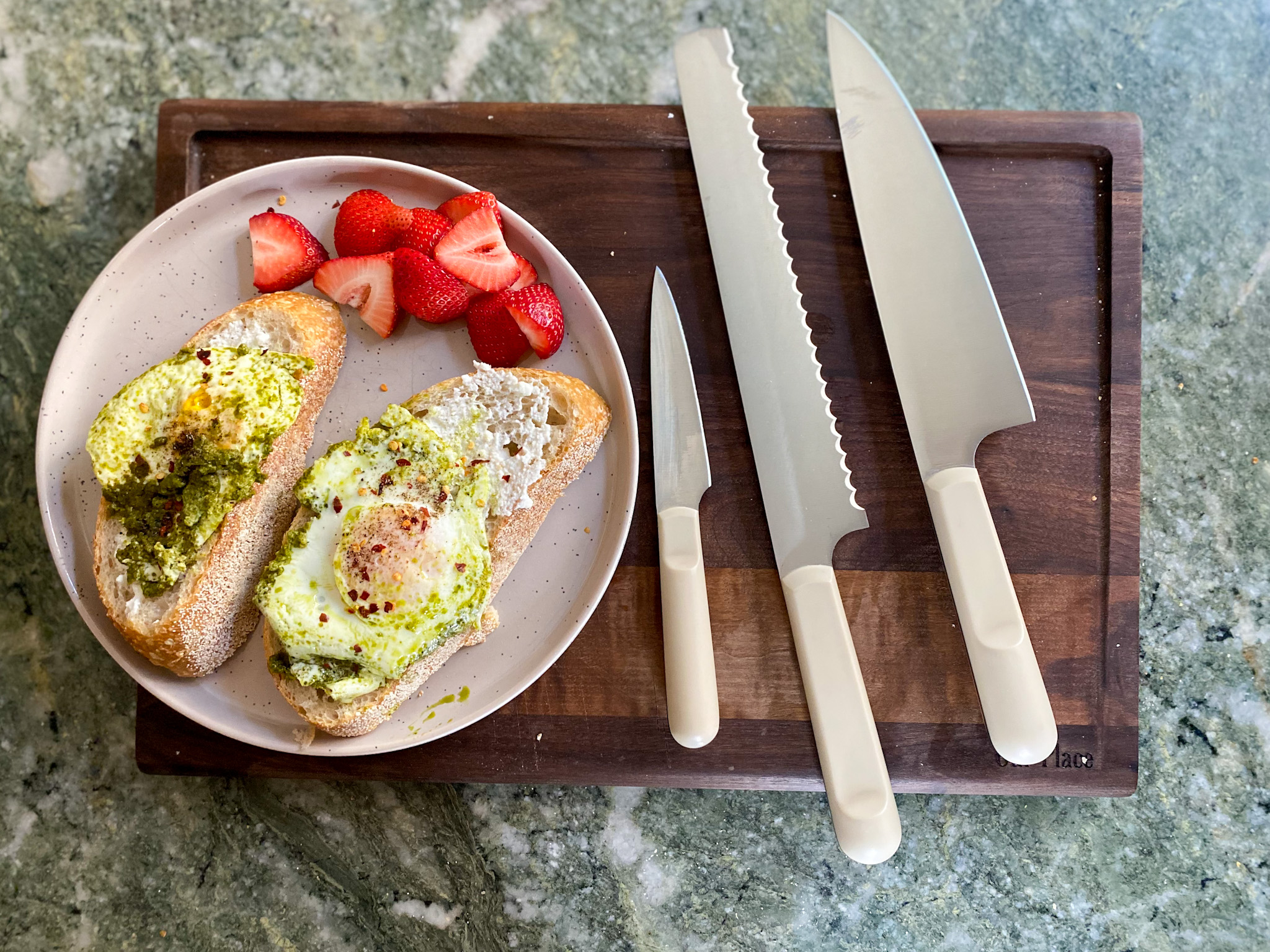 Our Place Knives Review knives on a chopping board and plate with food