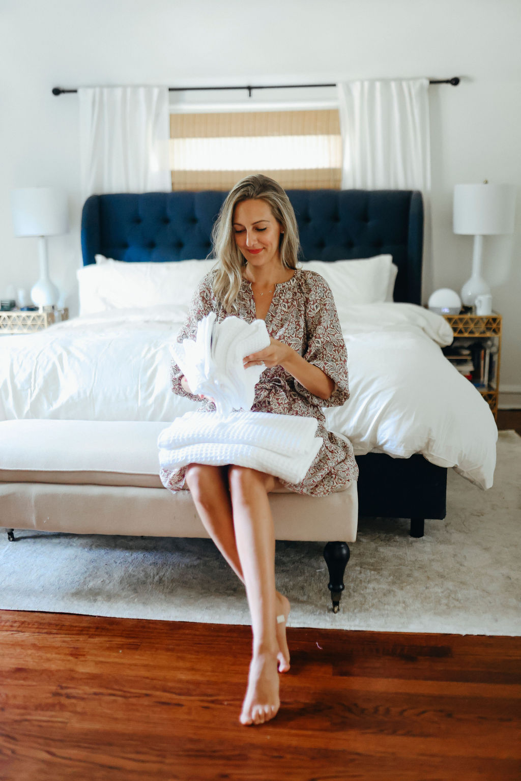 woman folding linens