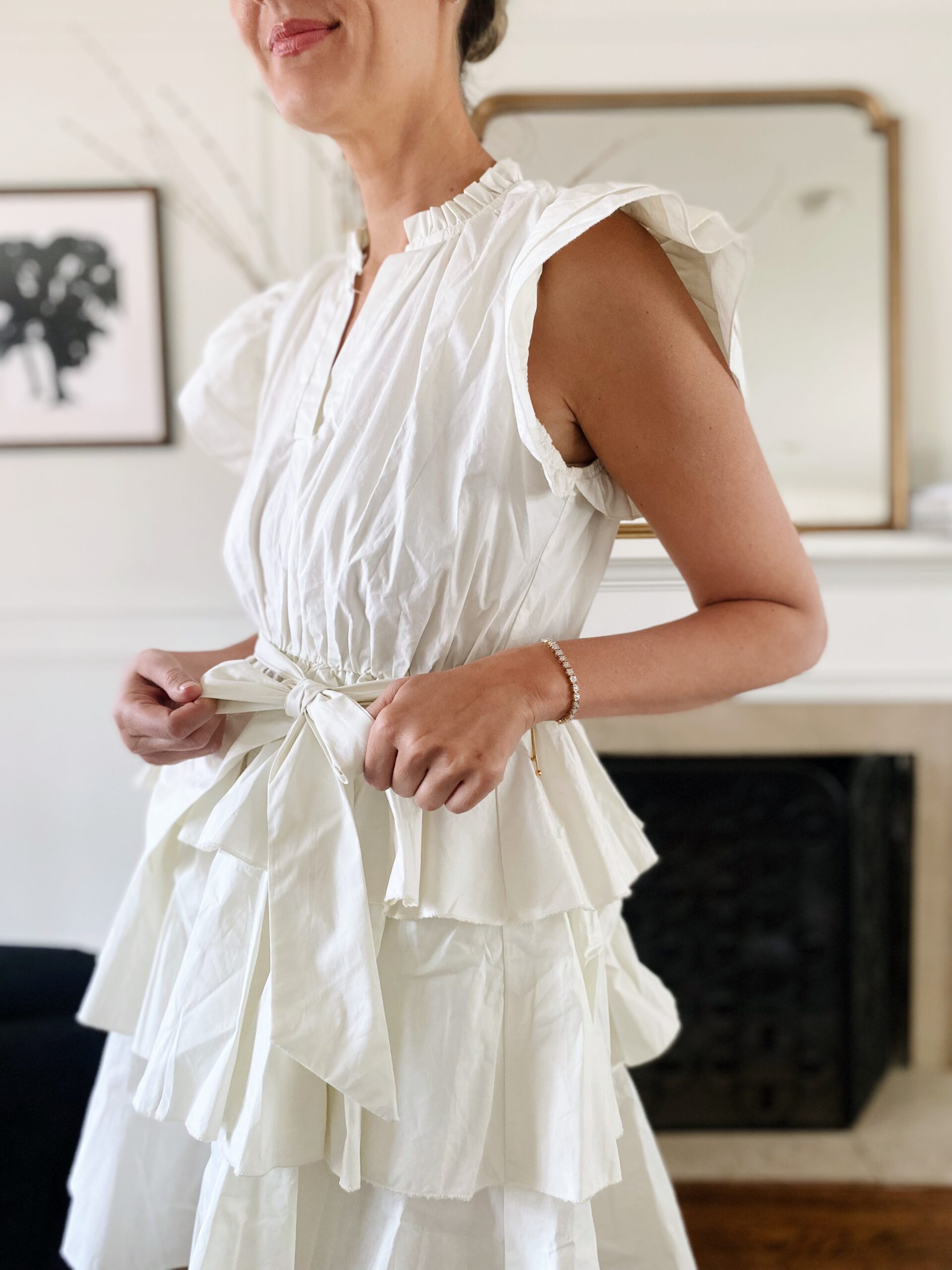 woman tying the tie on her dress