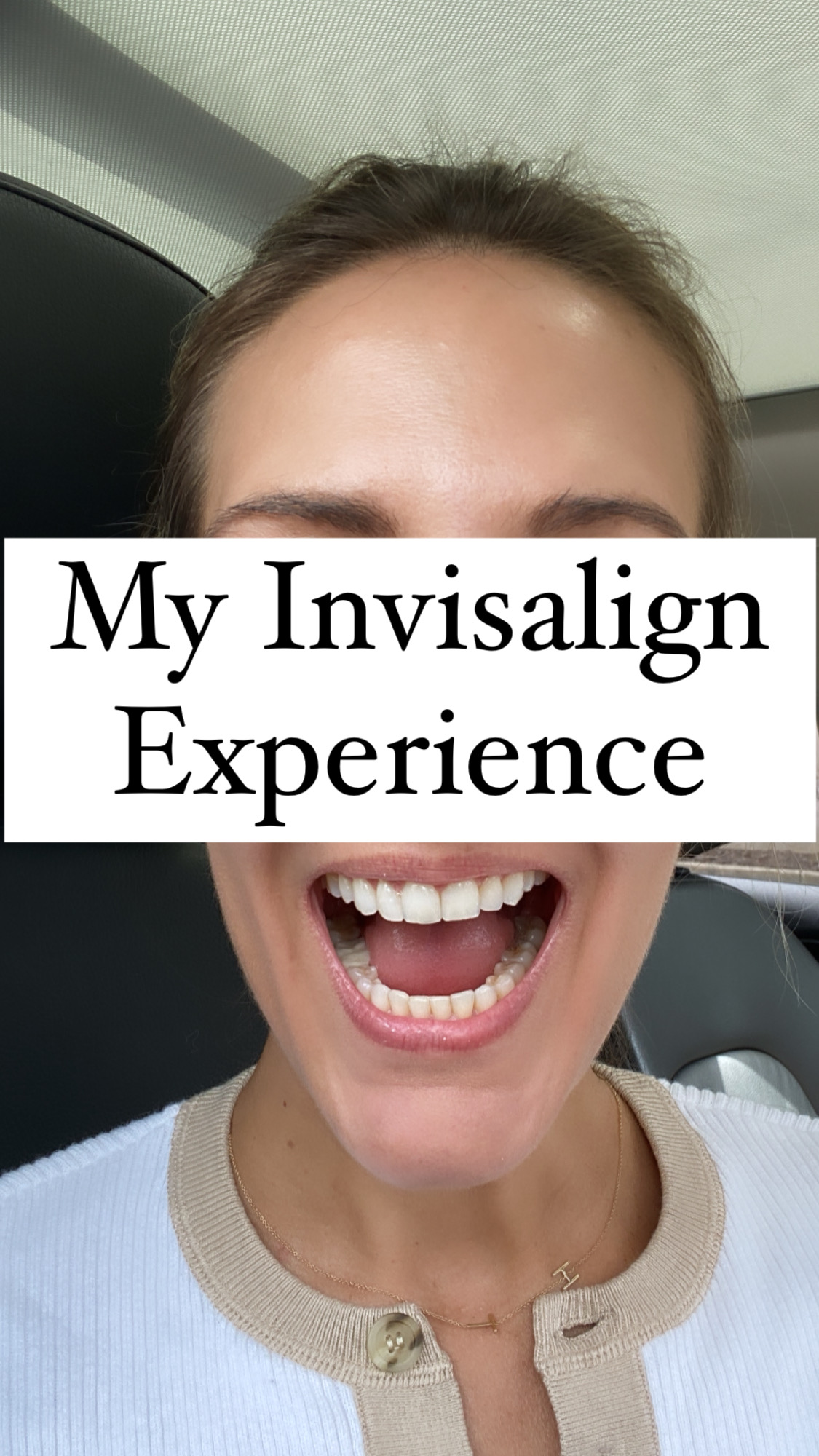 woman showing her Invisalign results