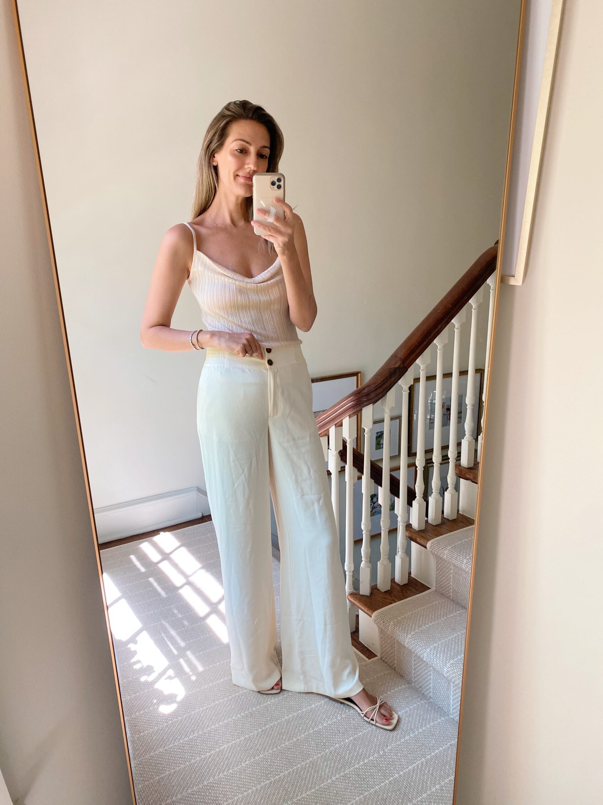 woman wearing white top and wide legged pants from Karen Millen