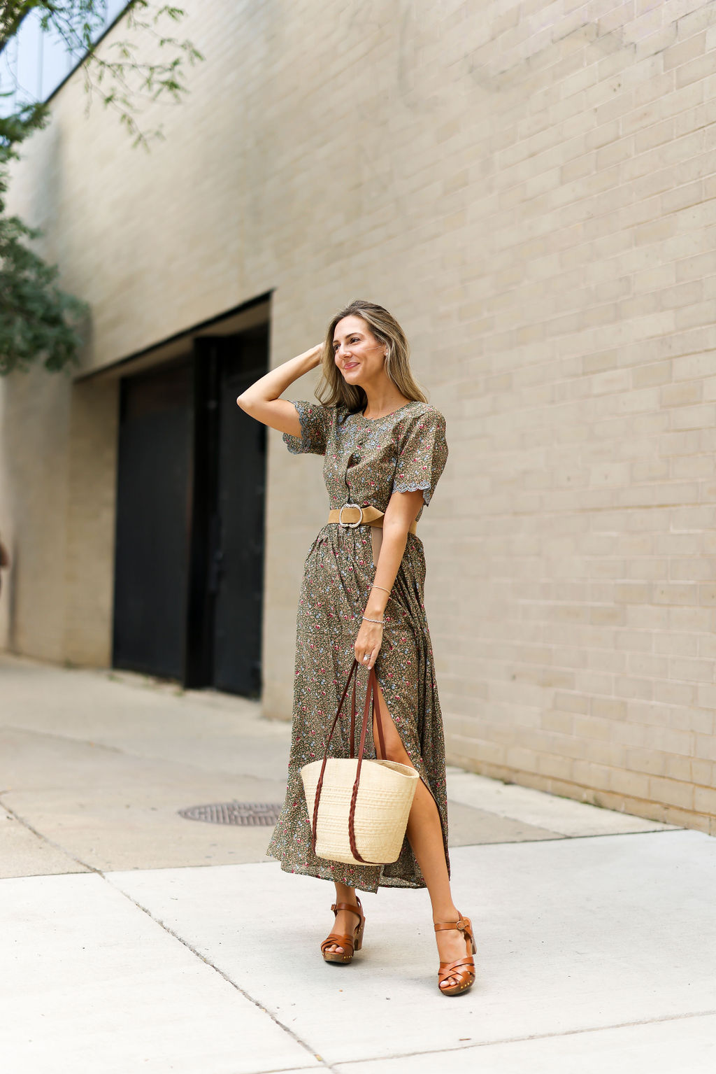 woman in long floral dress with slit