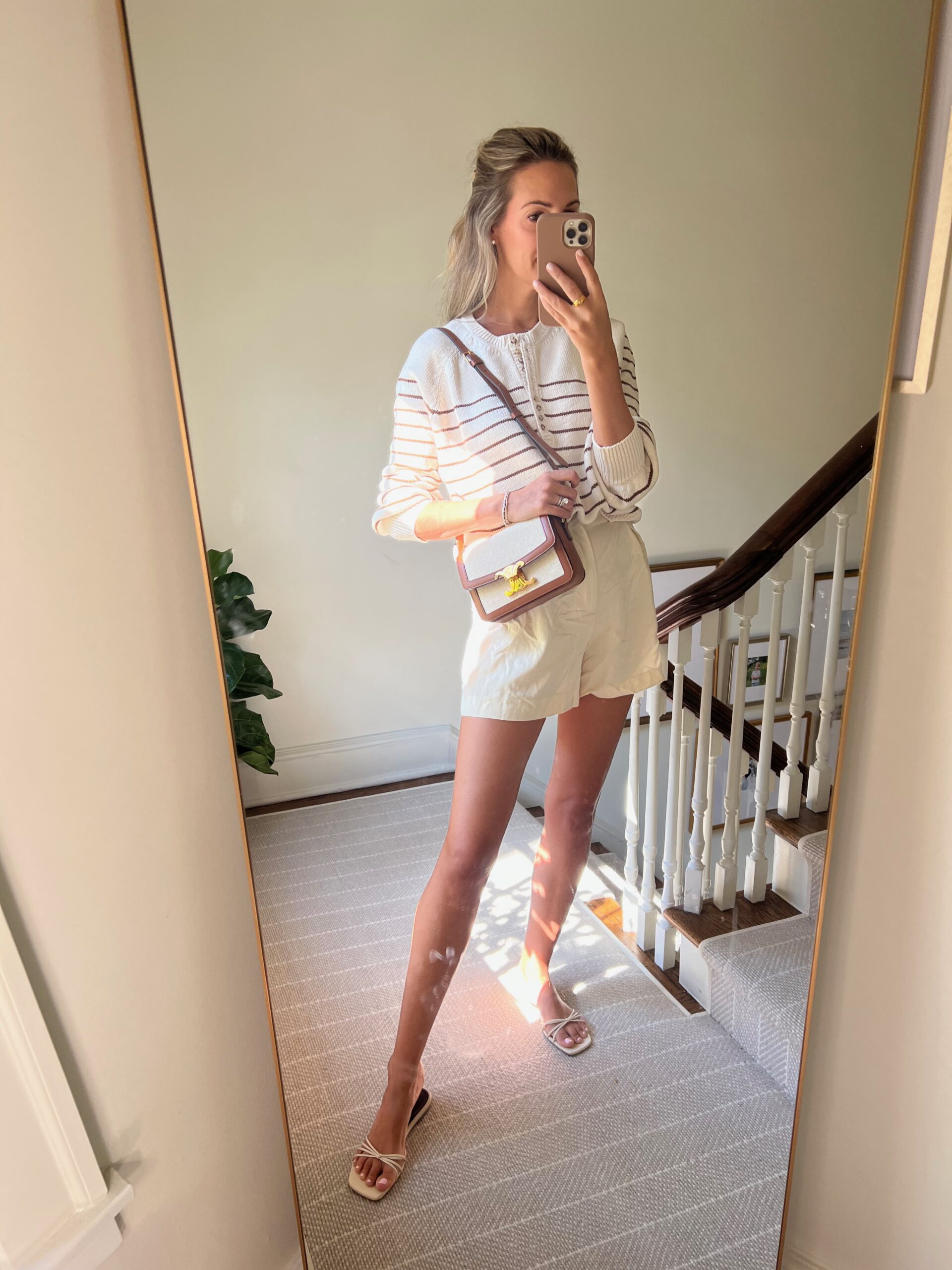 woman in sweater and shorts for Real Outfit Recap