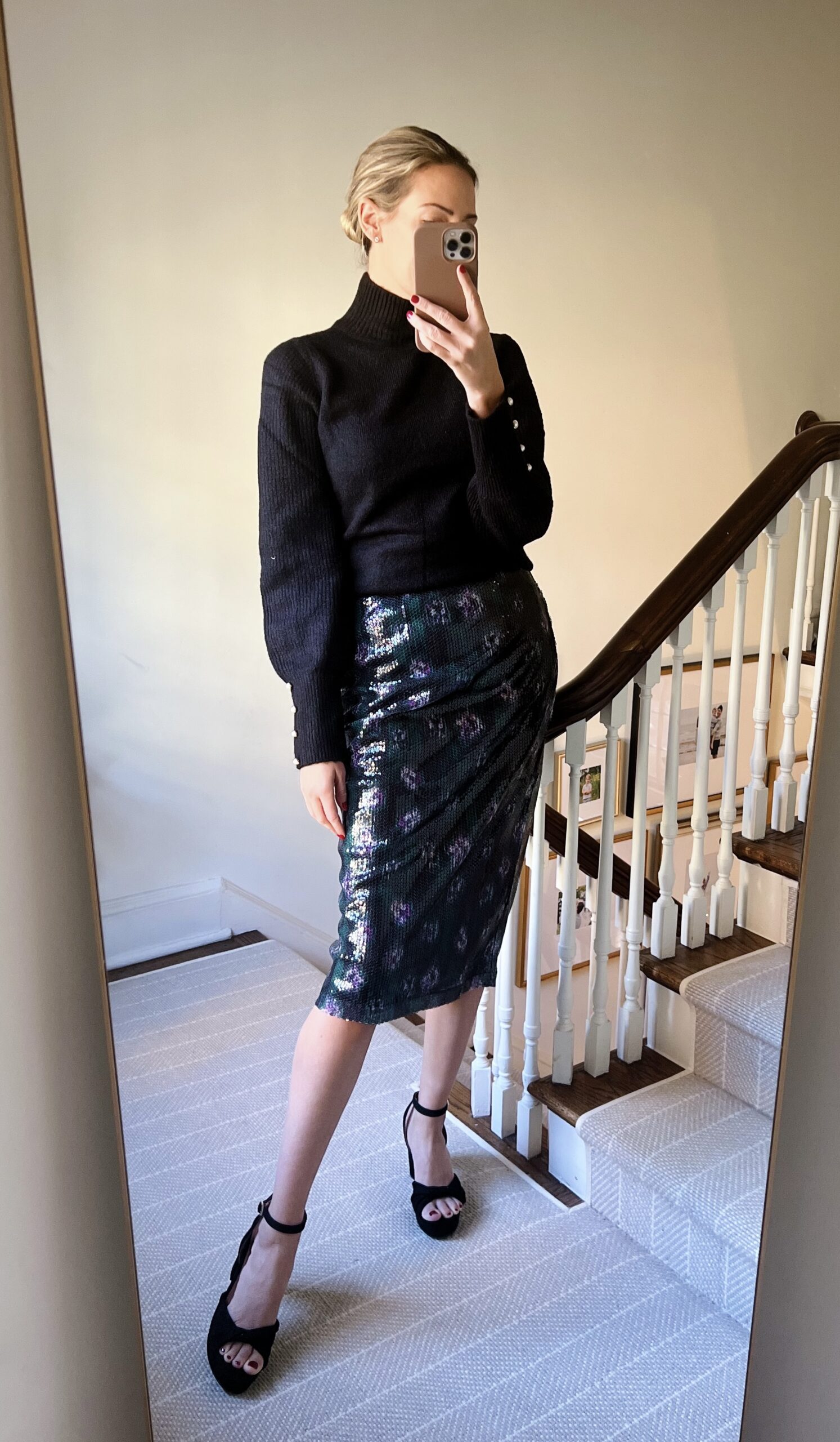 woman in black turtle neck and glitter skirt