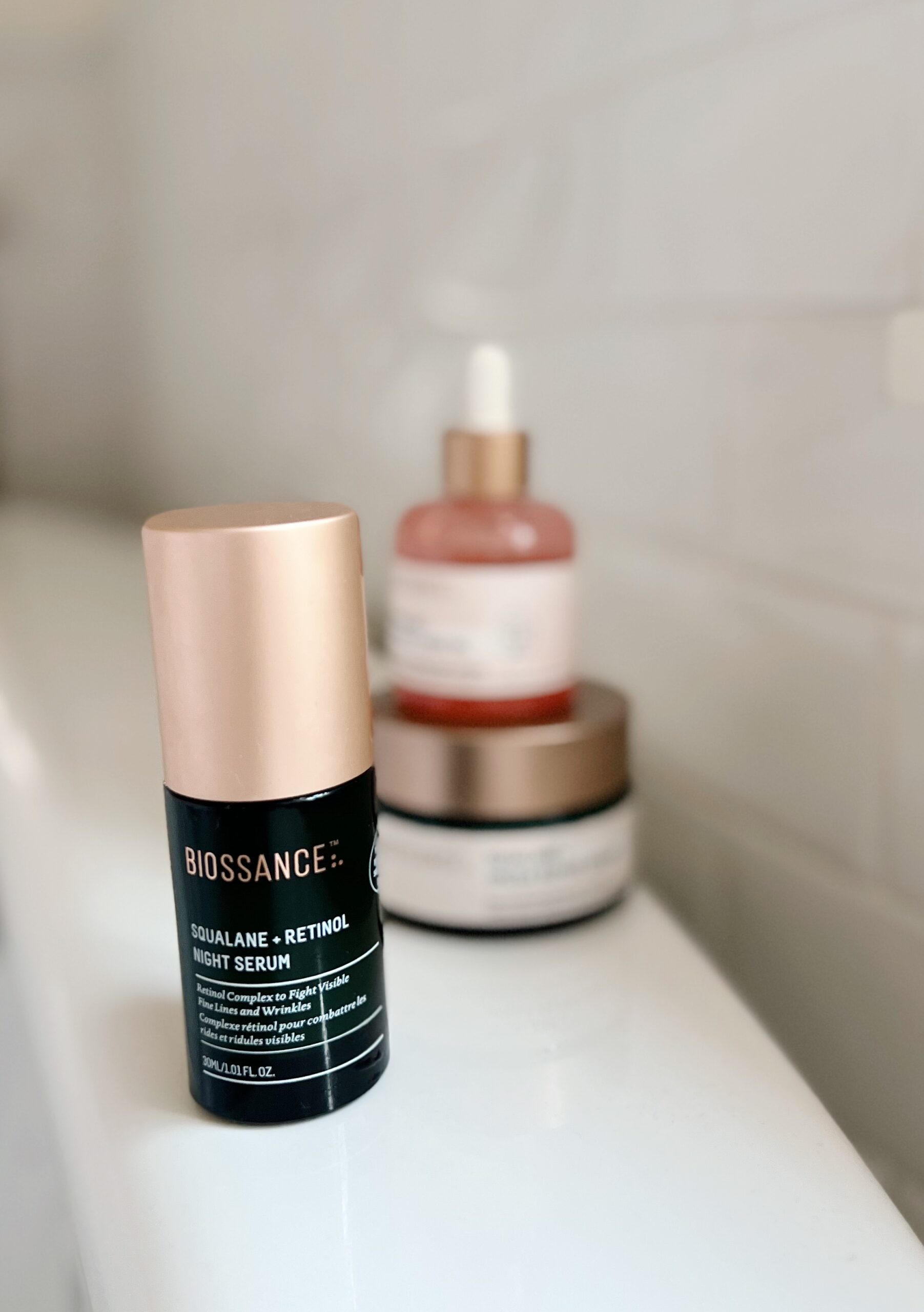 a bottle of Biossance Squalane + Retinol Serum  