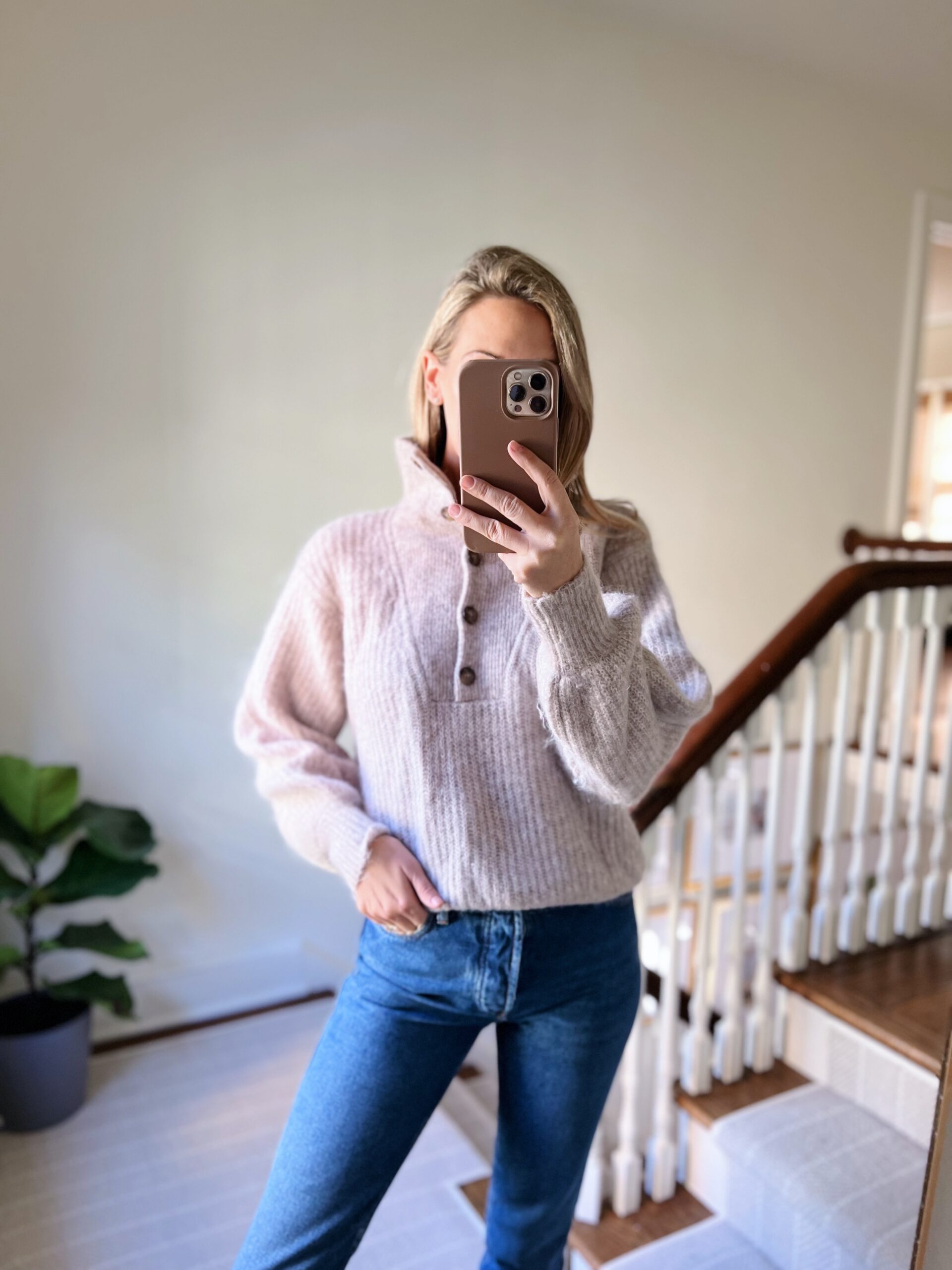 woman wearing sweater and jeans 