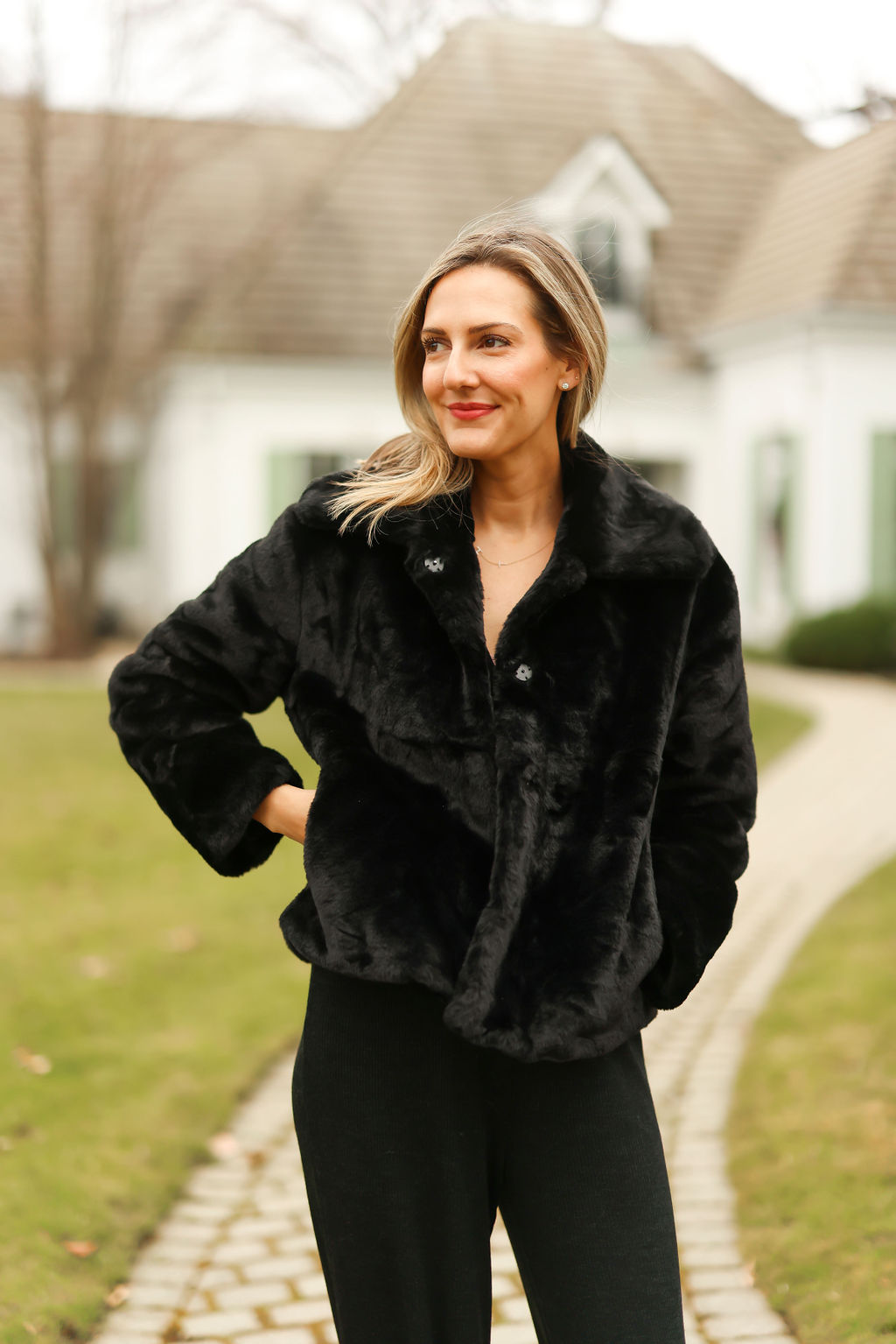 woman Getting Cozy in her black jacket and leggings