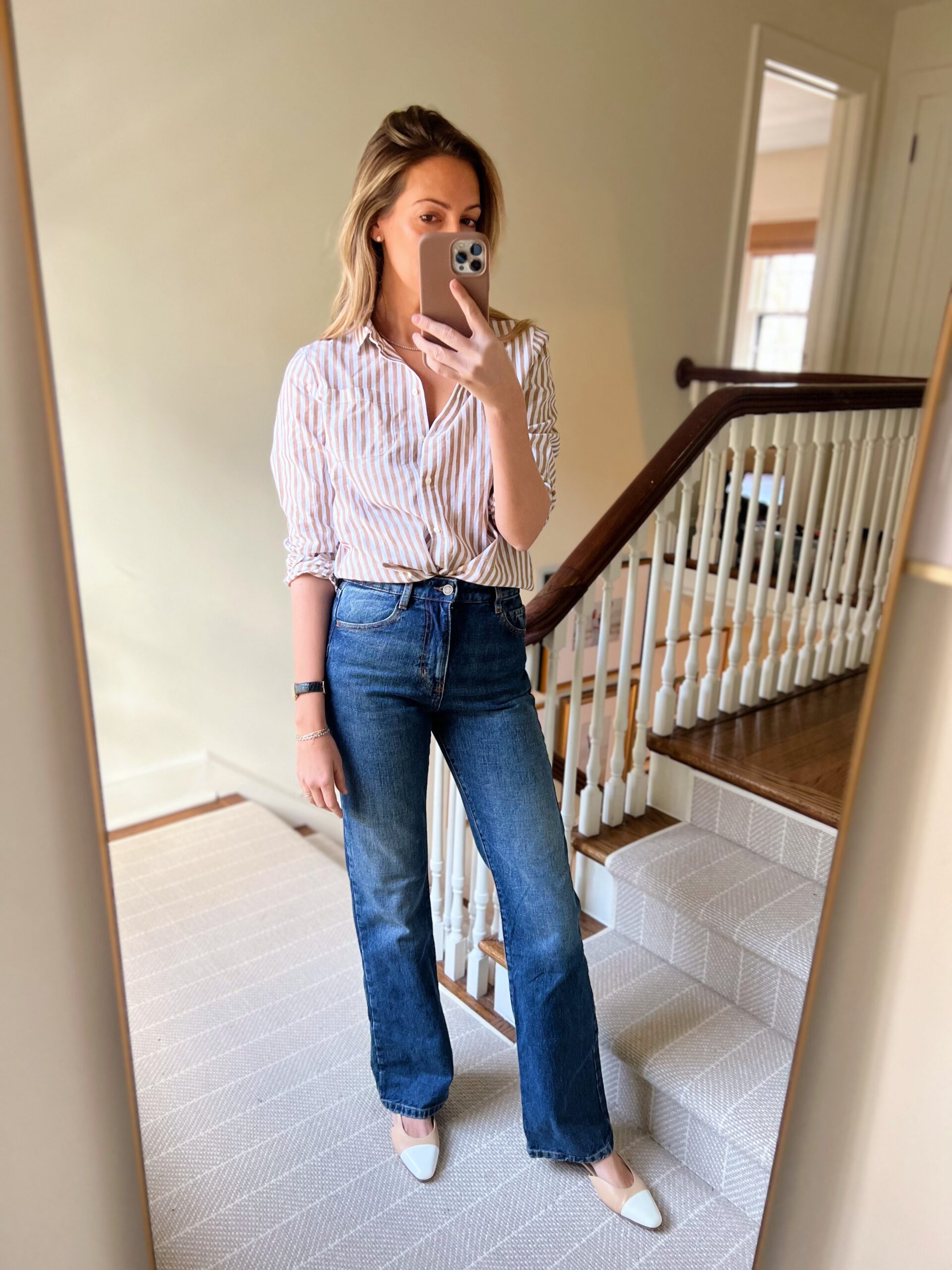 woman wearing January Refresh with Sézane striped button down and pants