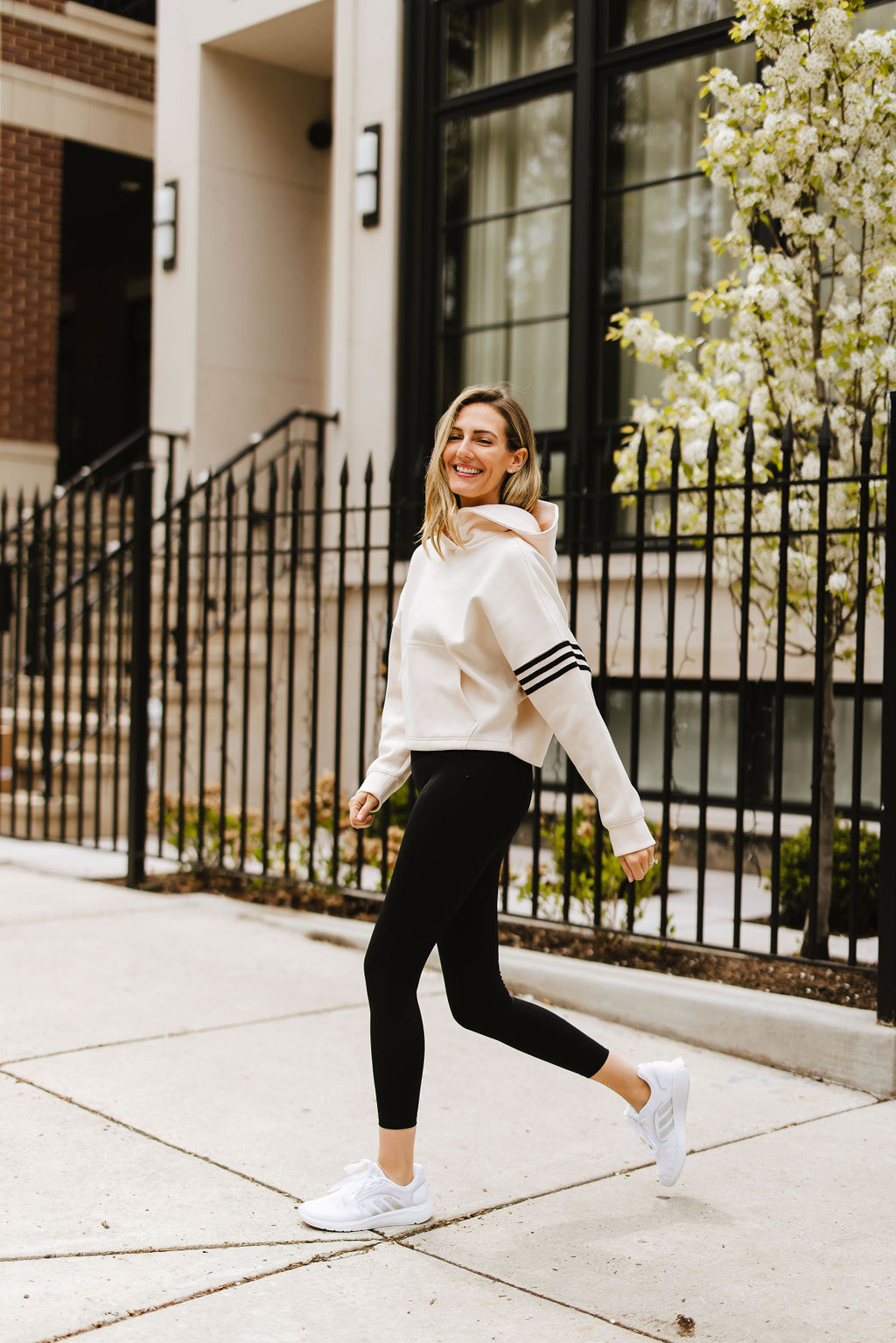 woman wearing jacket  and black leggings