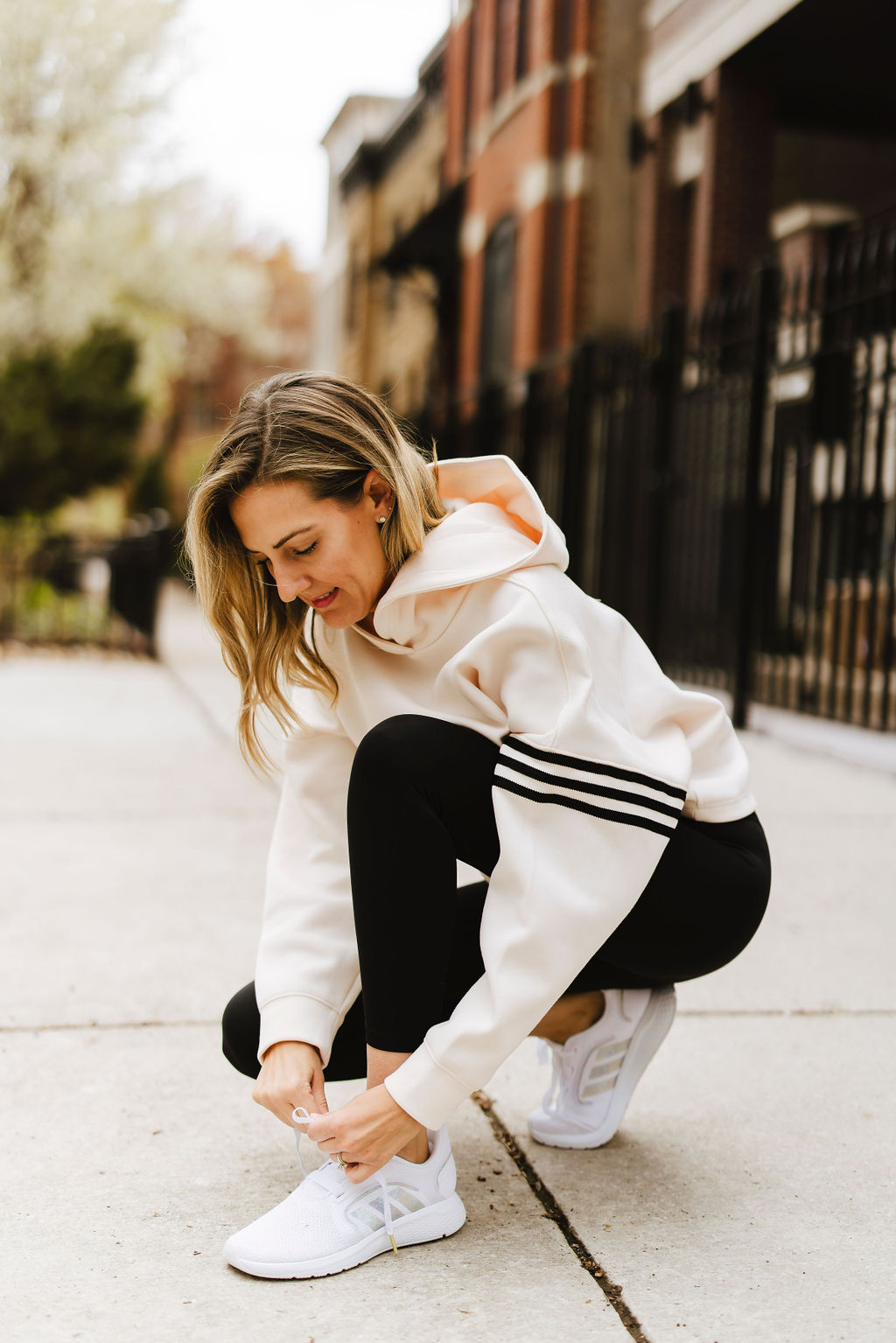 woman tying her shoes trying to Get Fit with adidas