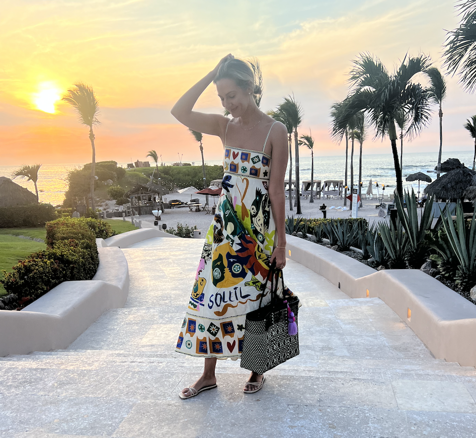 woman in printed dress sharing What I Wore in Punta Mita Mexico
